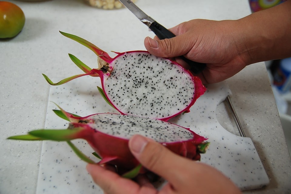 dragon fruit cut with knife